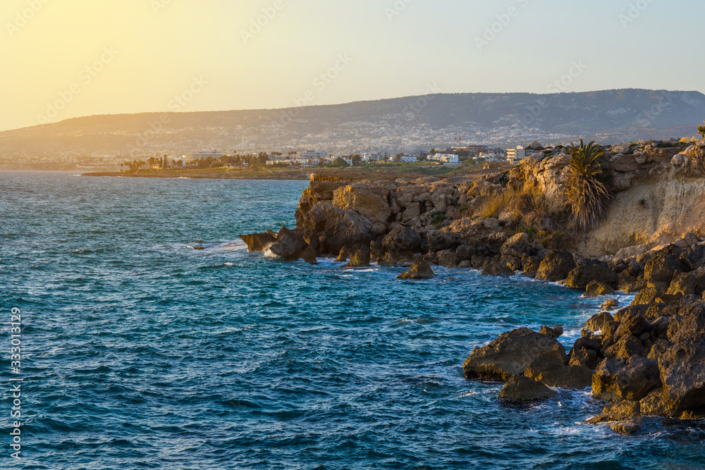 Cyprus coastline. Mediterranean rocky seashore at sunset. Travels and vacations concept.
