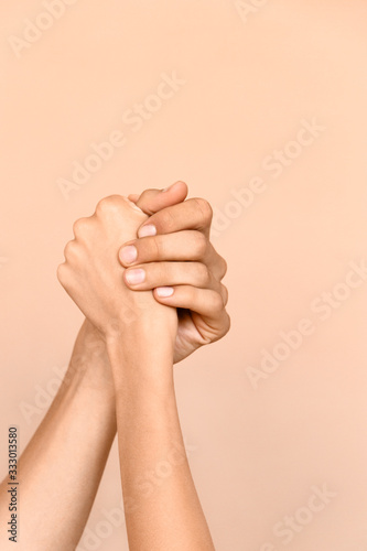 Crop couple competing in arm wrestling
