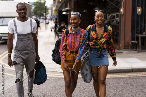 Group of friends walking on the strees of London