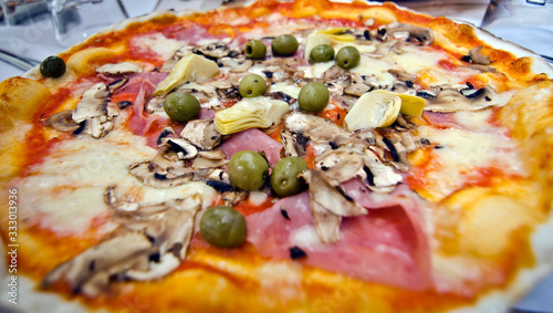 Close-up of Pizza Quattro Stagioni (Four Seasons). photo