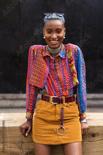 Portrait of a stylish afro woman in the city photo