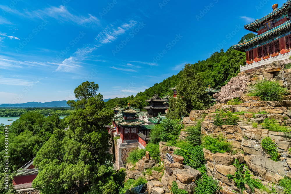 Pavilion hidden among the trees in the garden of Summer Palace, outskirts of Beijing, China