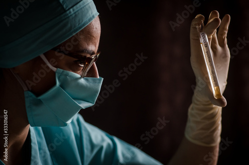 Doctor holding a coronavirus COVID-19 test tube