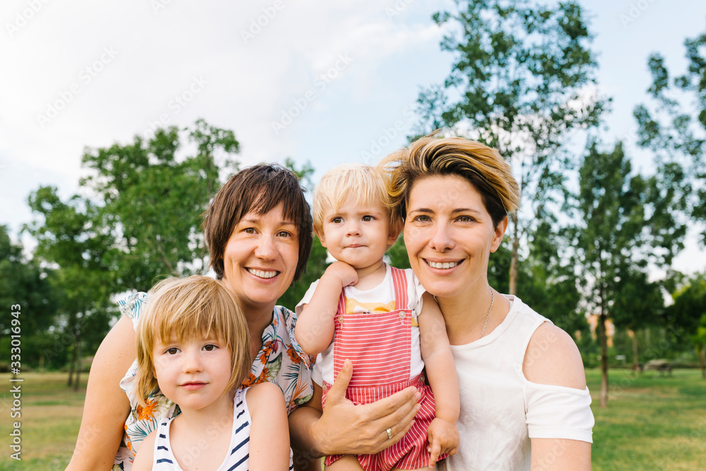 Gay family having fun in the park Gay family having fun in the park