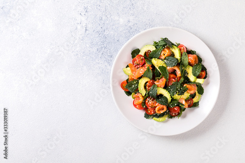 Salmon Salad with Vitamins in vegetables, herbs and avocado