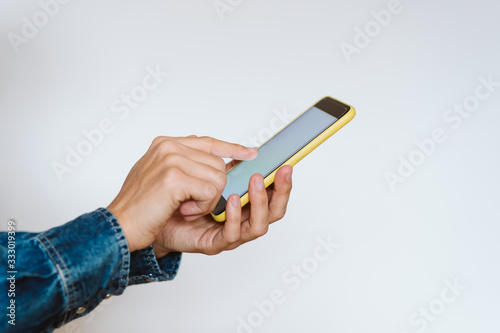 close up view of a woman using mobile phone indoors. Technology concept