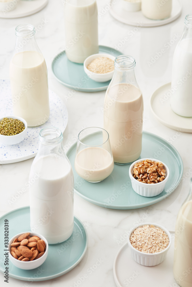 Assorted lactose free milk in bottles and cups Assorted lactose free milk in bottles and cups