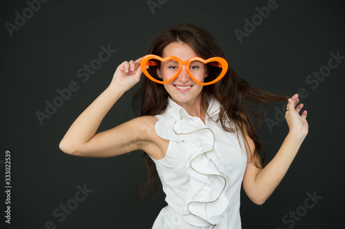 Im glad youre weird like me. Valentines girl wear heart shaped glasses. Happy woman with party look. Valentines day. Fashion accessory for Valentines day. Fashion and beauty. Valentines day party