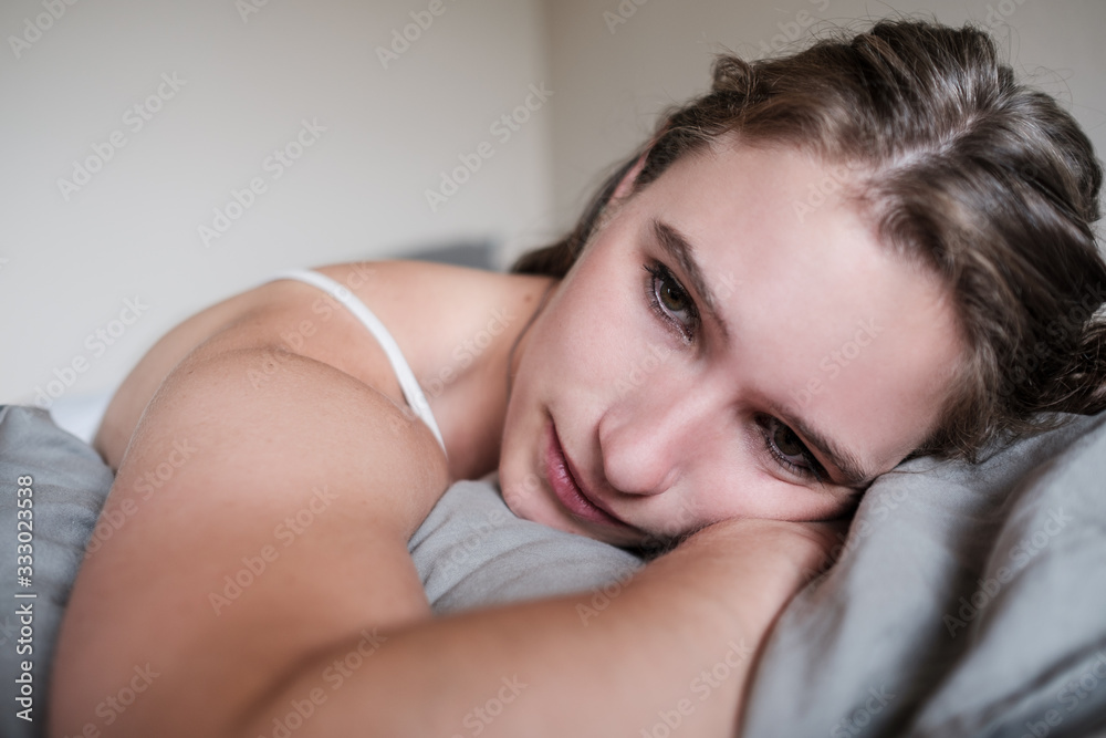 Beautiful Woman Lying Down on the Bed at Home Beautiful Woman Lying Down on the Bed at Home