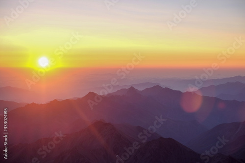 Dawn - sunset in the mountains with sunbeams