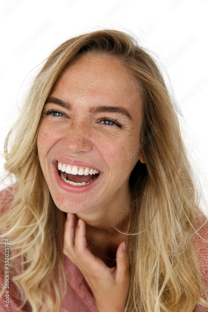 Laughing woman scratching neck Laughing woman scratching neck