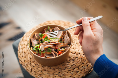 Man Eating Healthy Food On Sofa At Home