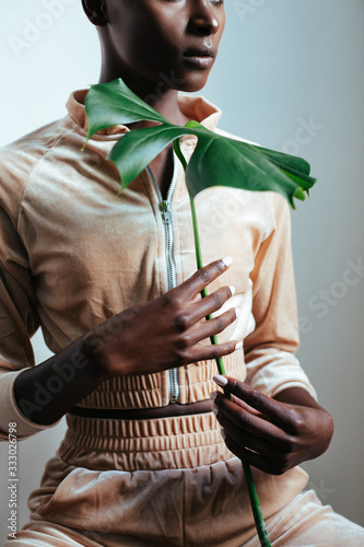 Gacile Black Woman With Monstera Leaf photo