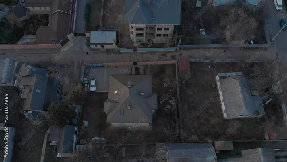 Poor city aerial view residential buildings and high rise building tilt up shot