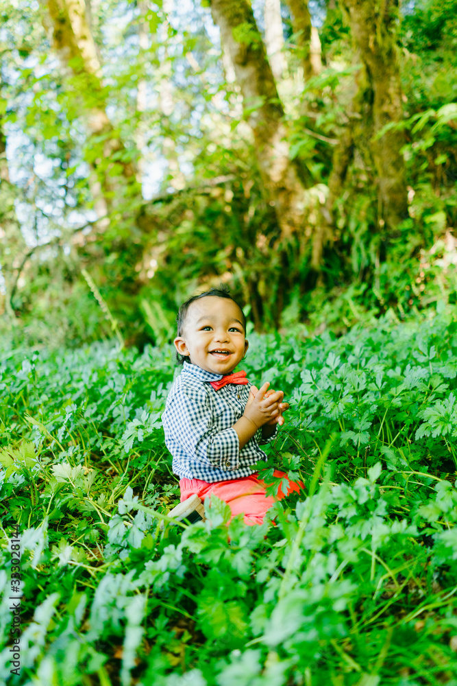 Closeup portrait of a baby boy smiling outdoors at a local park Closeup portrait of a baby boy smiling outdoors at a local park