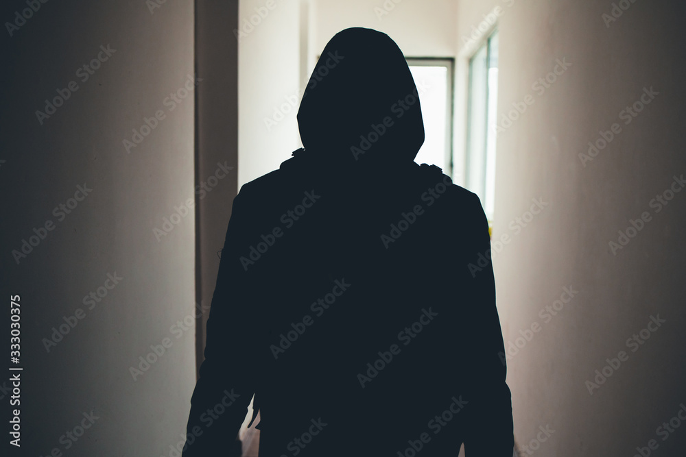 Ταπετσαρία Silhouette of a man sneaking through the hallway of a house