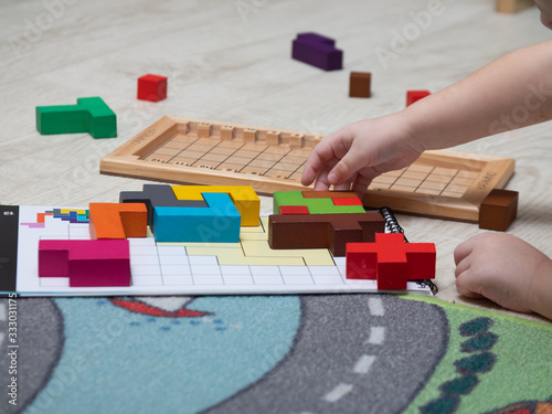 MOSCOW, RUSSIA-March 3, 2020: Katamino is a Board puzzle game. Children play a Board game. Educational games for children. This game was developed by Andre Periolat company