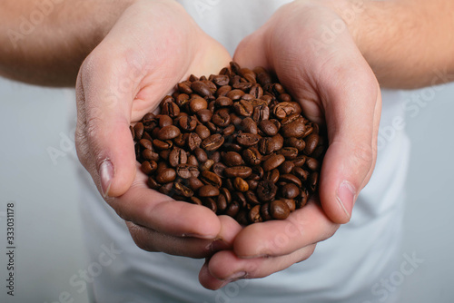 Man holding coffee and enjoys the aroma close up