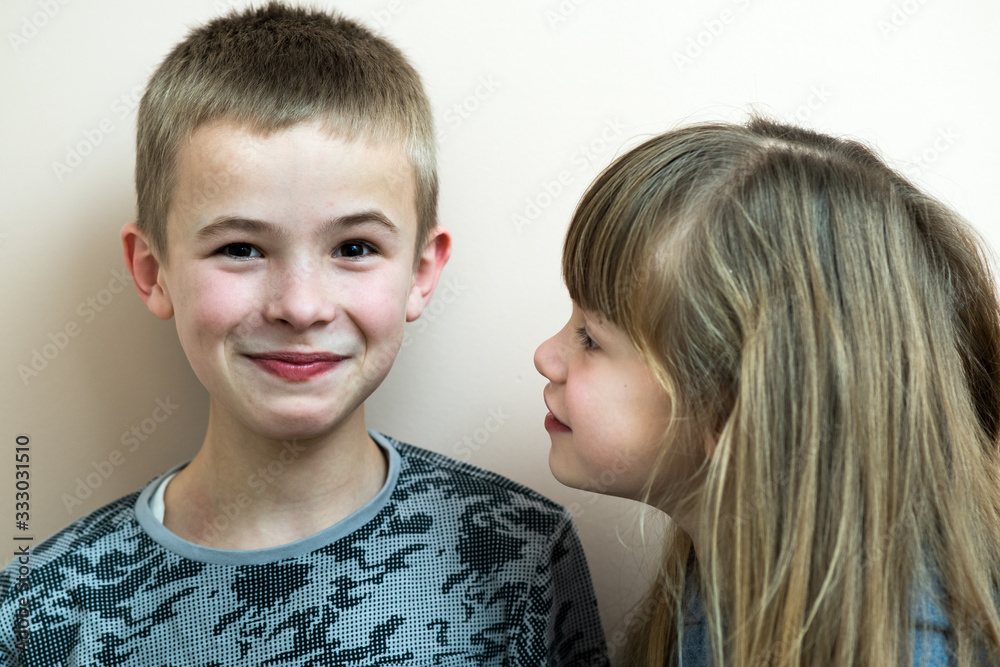 Two children boy and girl fooling around having fun together. Happy childhood concept. Two children boy and girl fooling around having fun together. Happy childhood concept.