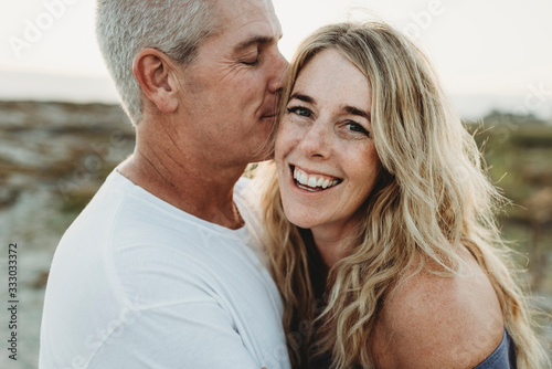 Close up of wife and husband being close at beach