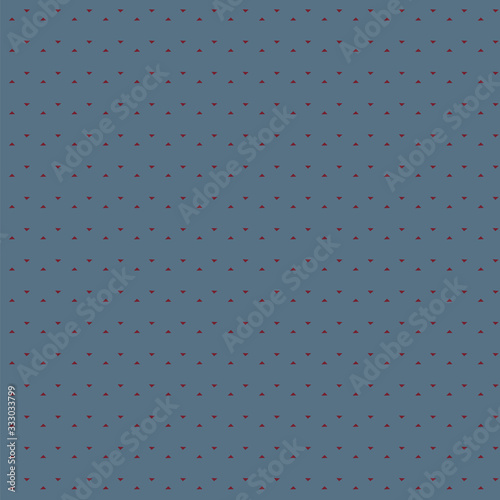Seamless pattern of small triangles floating on a dusty blue background