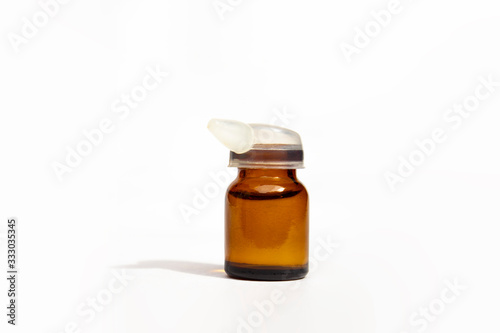 Closed medicine bottle with dropper isolated on white background.Little dropper bottle.High resolution photo.