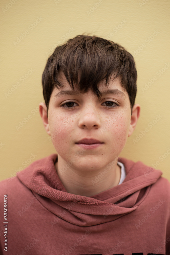 Closeup portrait of a young teenager looking to camera Closeup portrait of a young teenager looking to camera