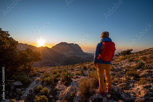 A woman hiking in the high country, El Divino mountain, Costa Blanca photo