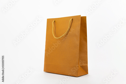 Paper bag mock up with handles on gray background. High resolution.