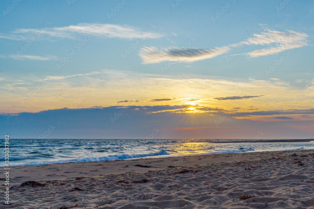 Sunset on the beach on north side of the Provincelands Cape Cod, Atlantic ocean view MA US. Sunset on the beach on north side of the Provincelands Cape Cod, Atlantic ocean view MA US.