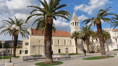 Church behind palm tree in Trogir Croatia © Daniel