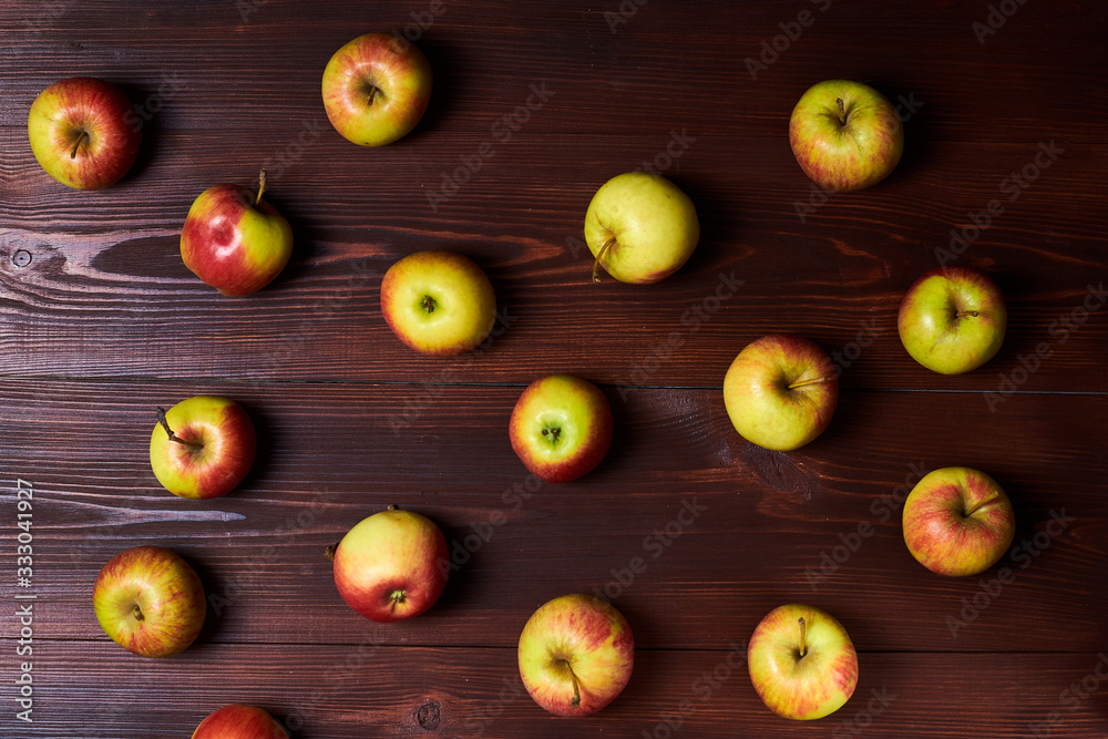 Fresh red-green apples on a wooden background. Fresh red-green apples on a wooden background.