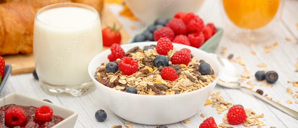 Breakfast Served in the morning with Butter croissant and corn flakes Whole grains and raisins with milk in cups and Strawberry, Blueberry, Raspberry, Kiwi, Fresh Orange Juice on the breakfast table. Breakfast Served in the morning with Butter croissant and corn flakes Whole grains and raisins with milk in cups and Strawberry, Blueberry, Raspberry, Kiwi, Fresh Orange Juice on the breakfast table.