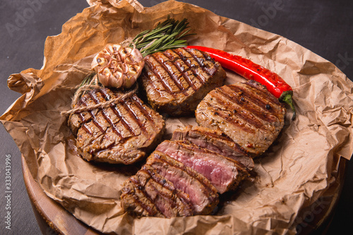 grilled meat medallions grilled vegetables dark background craft bbq