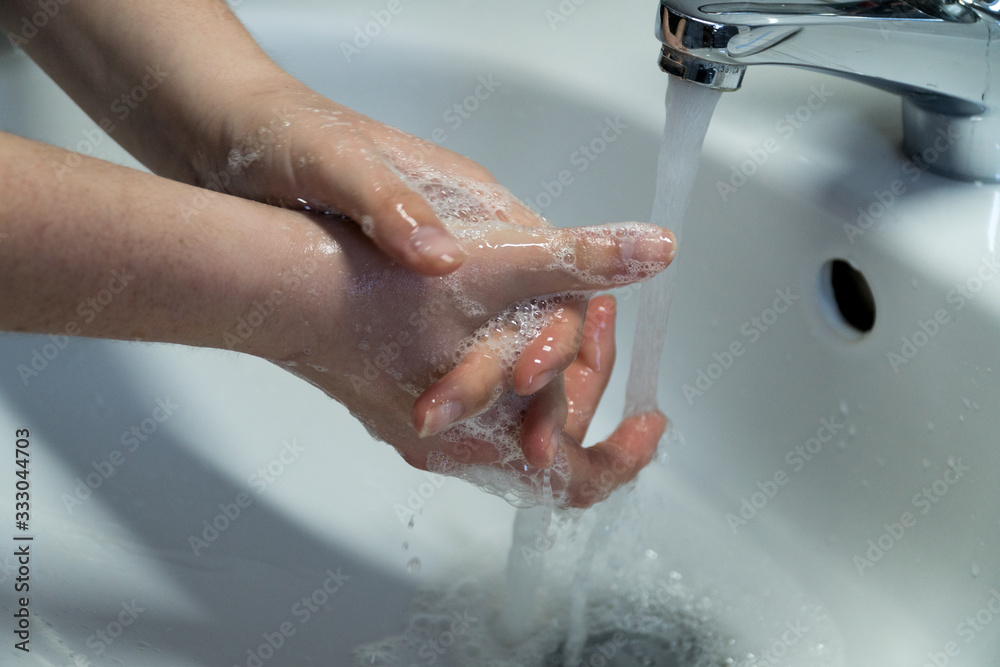 Fototapeta premium Washing Hands In Clean Sink