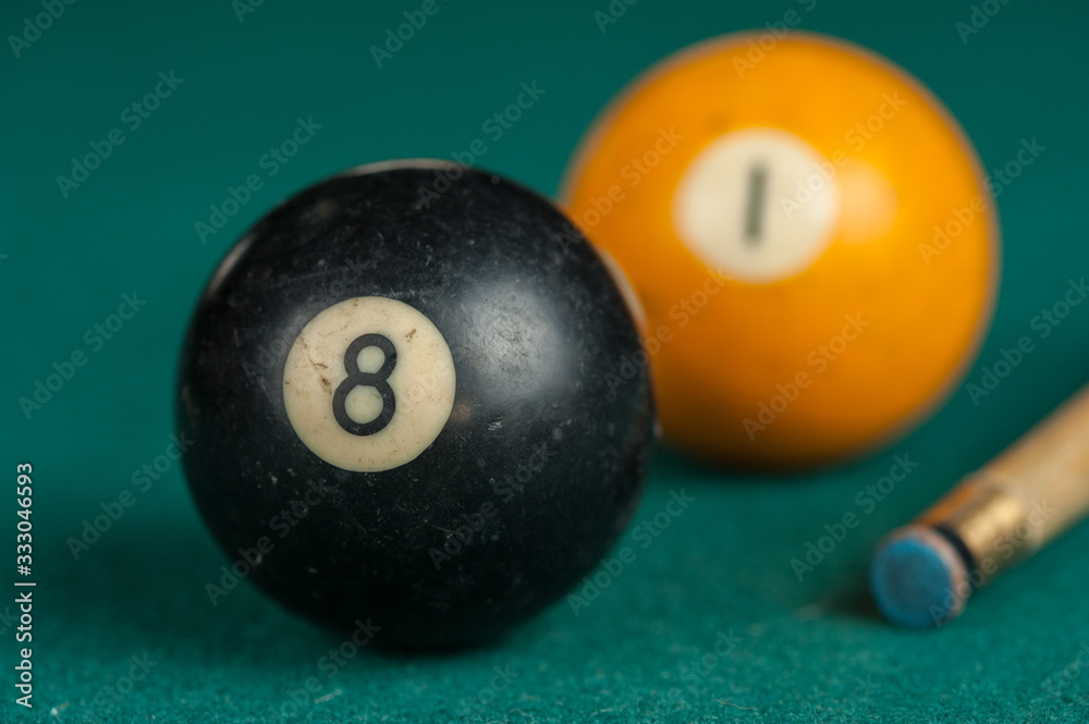 Billiards balls and cue on billiards table. Billiard sport concept. Billiards balls and cue on billiards table. Billiard sport concept.