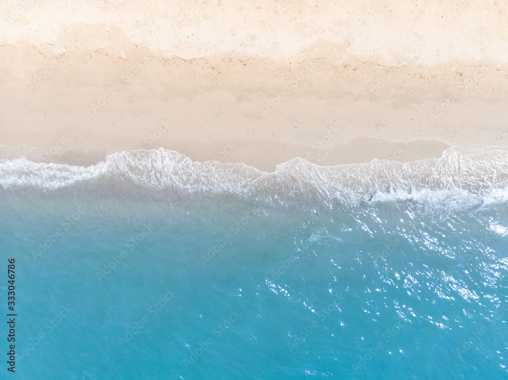 Blue sea and white sand beach in summer landscape for web advertisment and poster background.Aerial view of seashore coastline by drone