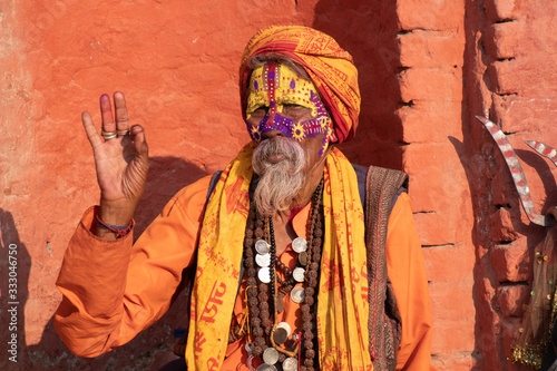 Kathmandu Sadhu men holy person in hinduism with traditional painted face at Pashupatinath Temple of Kathmandu photo
