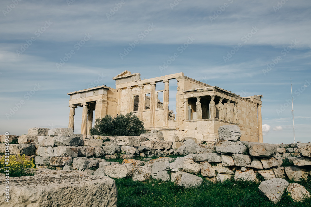 View of the Erechteum Temple and the blue sky at Acropolis. Athens, Greece
