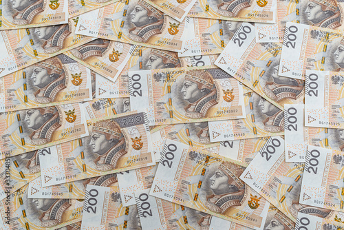 Background made from the front side of the Polish 200 PLN banknote, background for finance and economics.