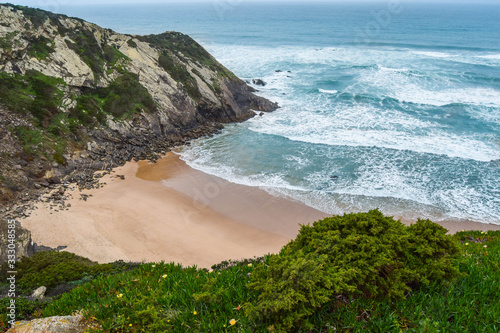 Adegas beach, in Aljezur, Portugal. Naturism beach surrounded by cliffs photo