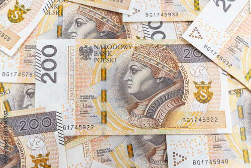 Background made from the front side of the Polish 200 PLN banknote, background for finance and economics.