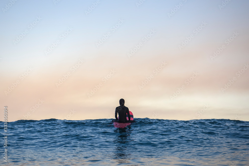 Surfer surfing at Bondi Beach, Sydney Australia