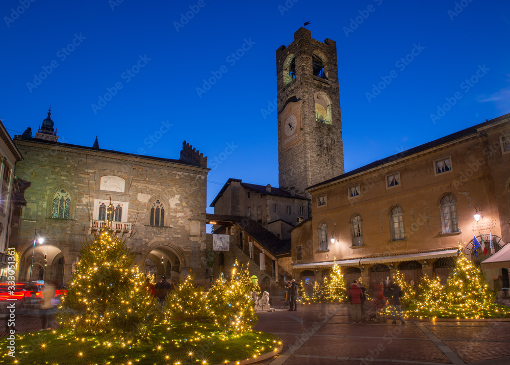 Fototapeta premium Bergamo old square with Christmas decorations illuminated for the holidays