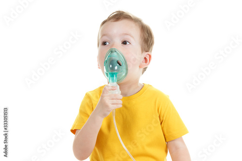Asthma patient, children boy diagnosis asthma inhalation therapy the mask of inhaler. Close up a little kid with respiratory disease problem