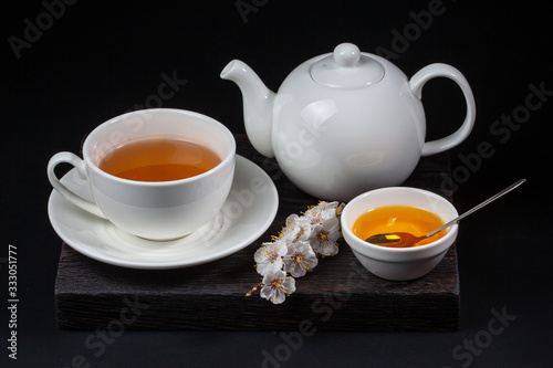 White porcelain tea set on a black background