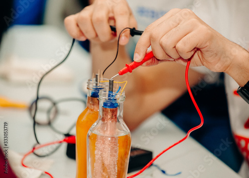 Electricity experiments with bottles and water photo