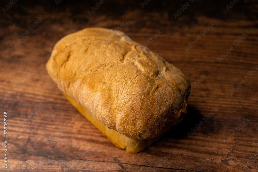 fresh baked bread oaf on a wood board fresh baked bread oaf on a wood board