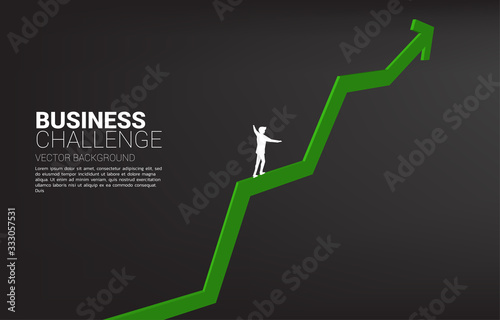 Silhouette of businessman walking on rope walk way up to growth graph.Concept for business risk and challenge in career path