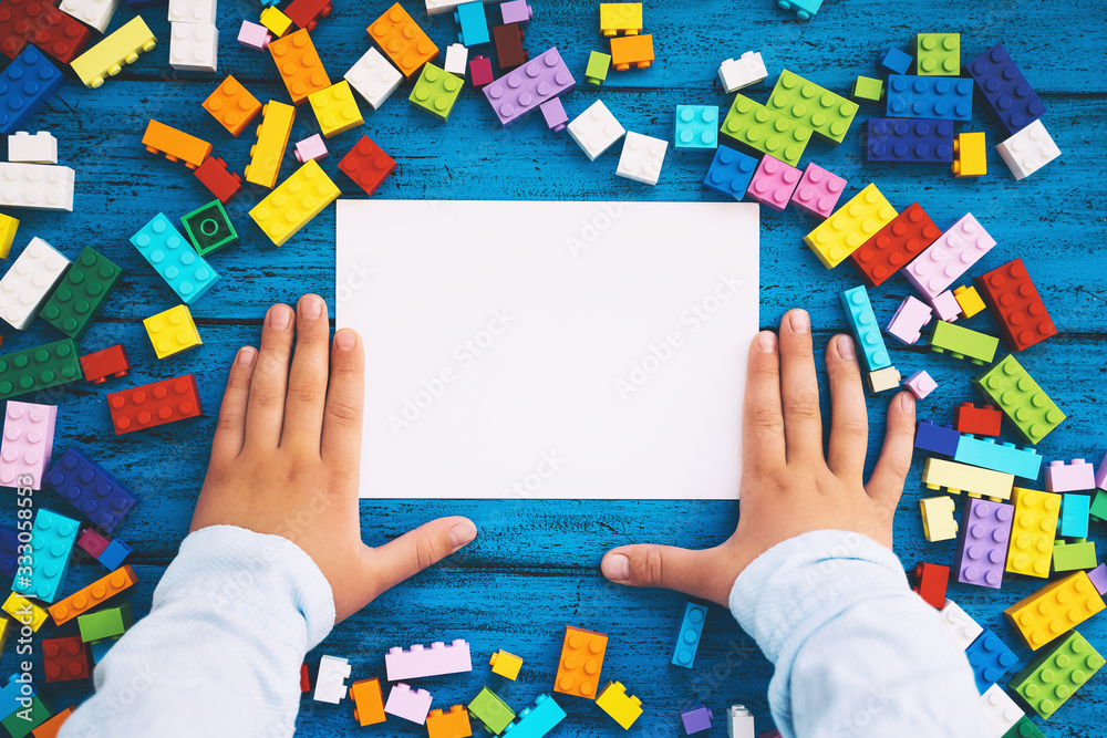 Сolourful creative children's background with colored toy bricks
